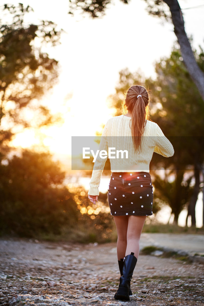 Rear view of woman walking in park