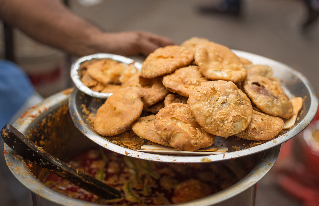 Close-up of hand serving street food