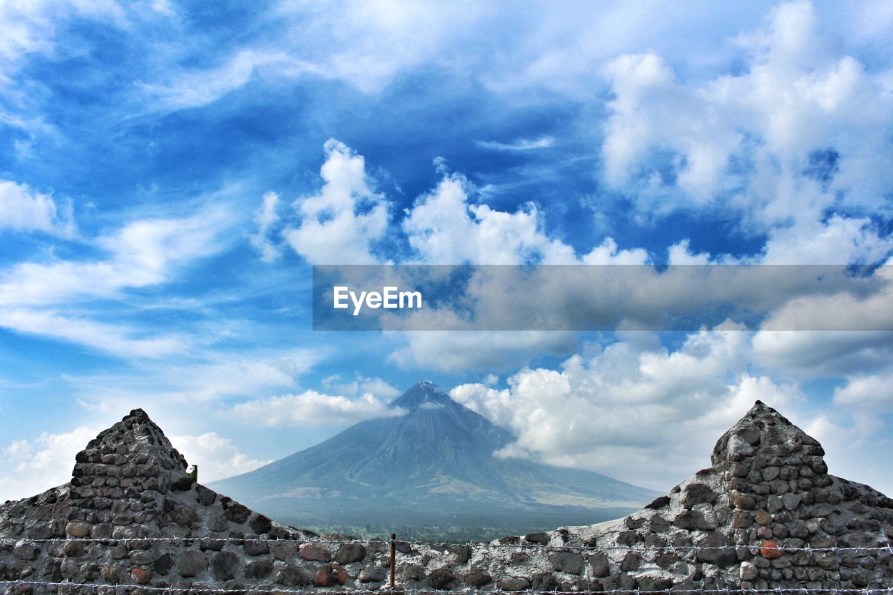 View of mountain range against cloudy sky