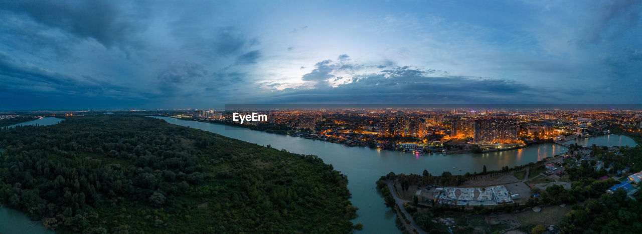 The city is visible in the palm of your hand and nature and the river the urban thread of buildings