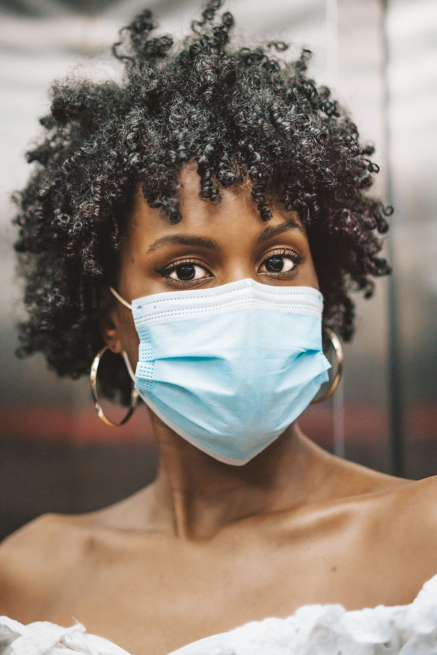 Young black woman wearing face mask