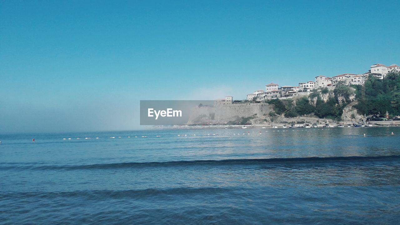 SCENIC VIEW OF CALM SEA AGAINST SKY