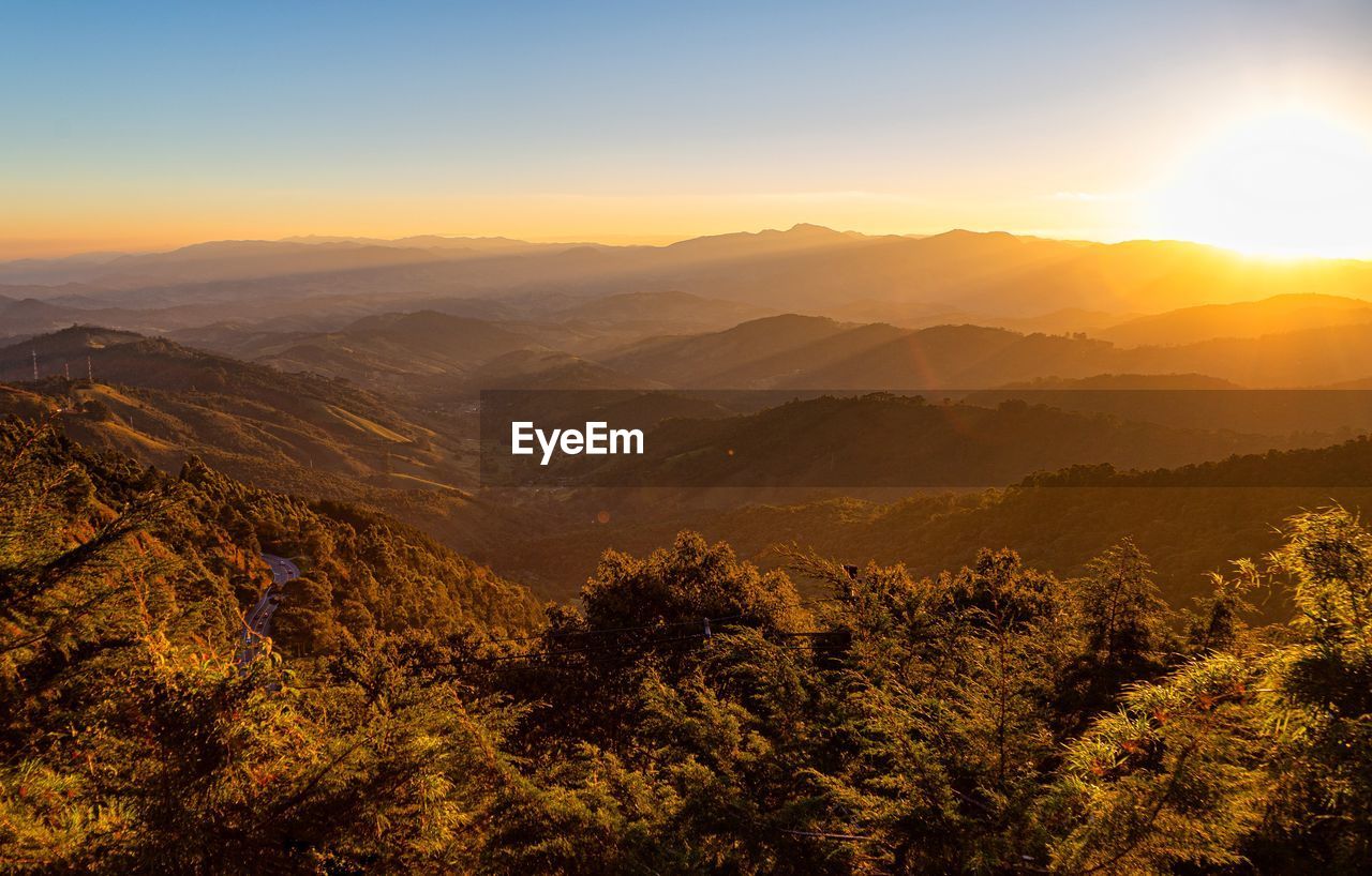 Scenic view of mountains against sky during sunset