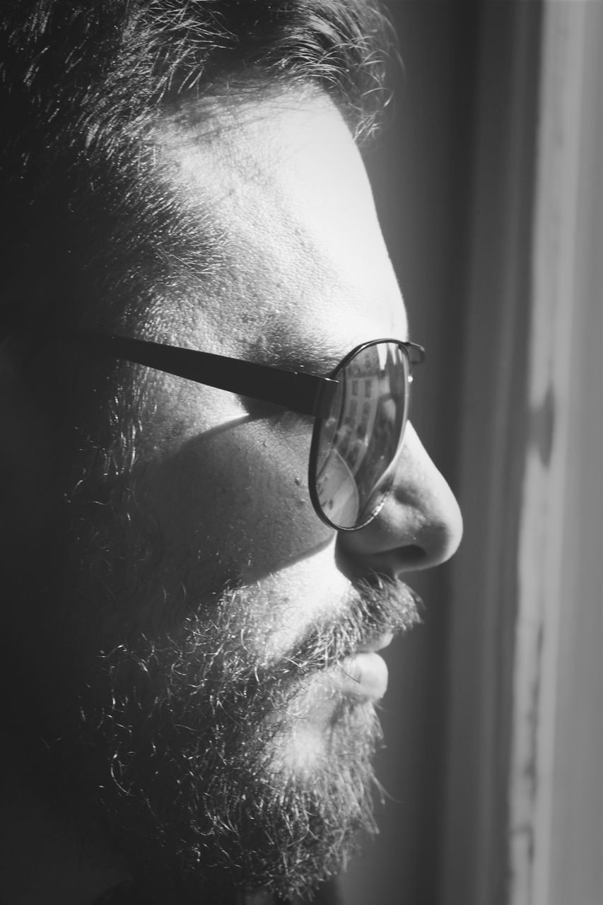 Close-up of man wearing sunglasses during sunny day