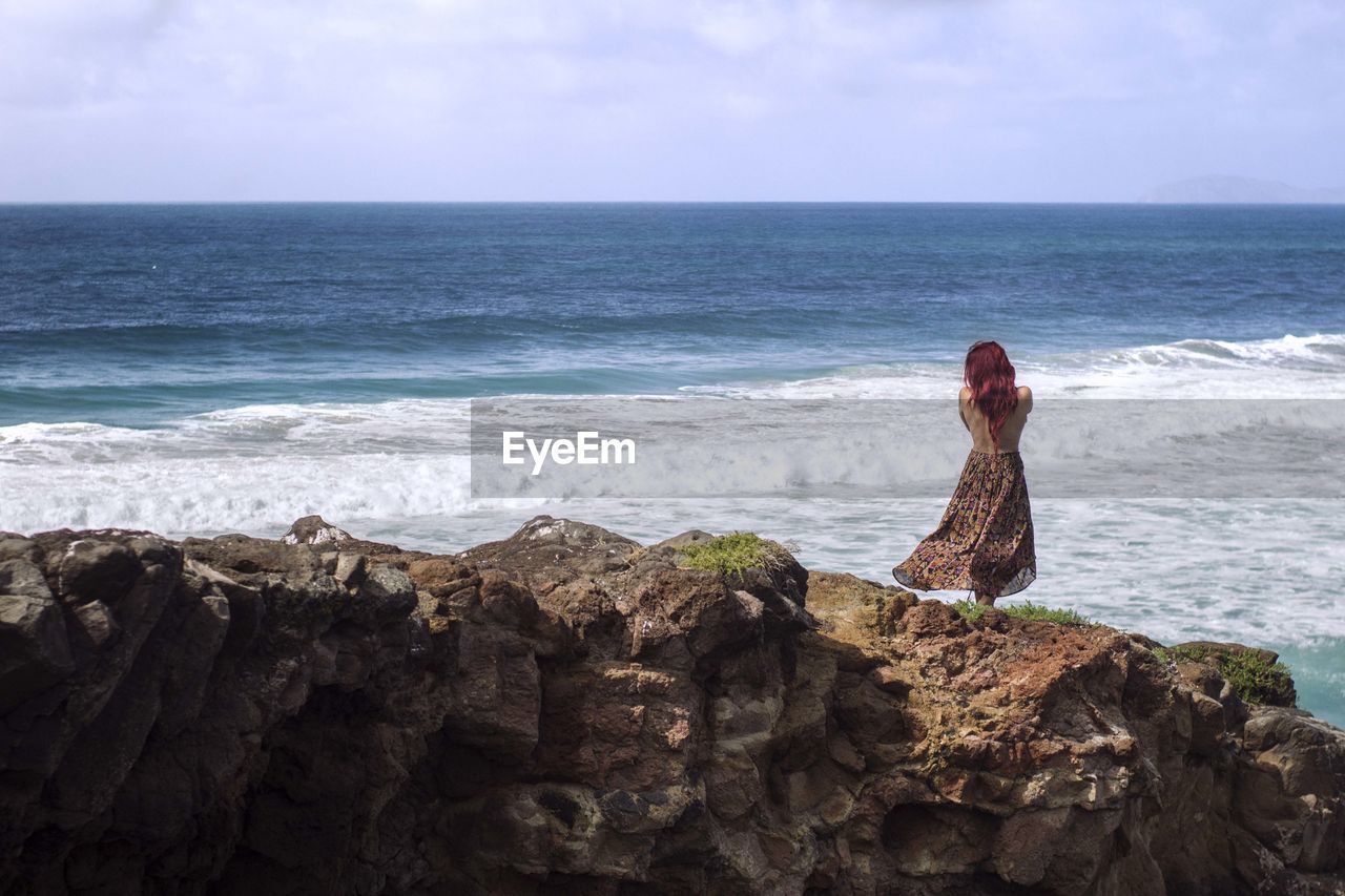 Scenic view of sea against cloudy sky