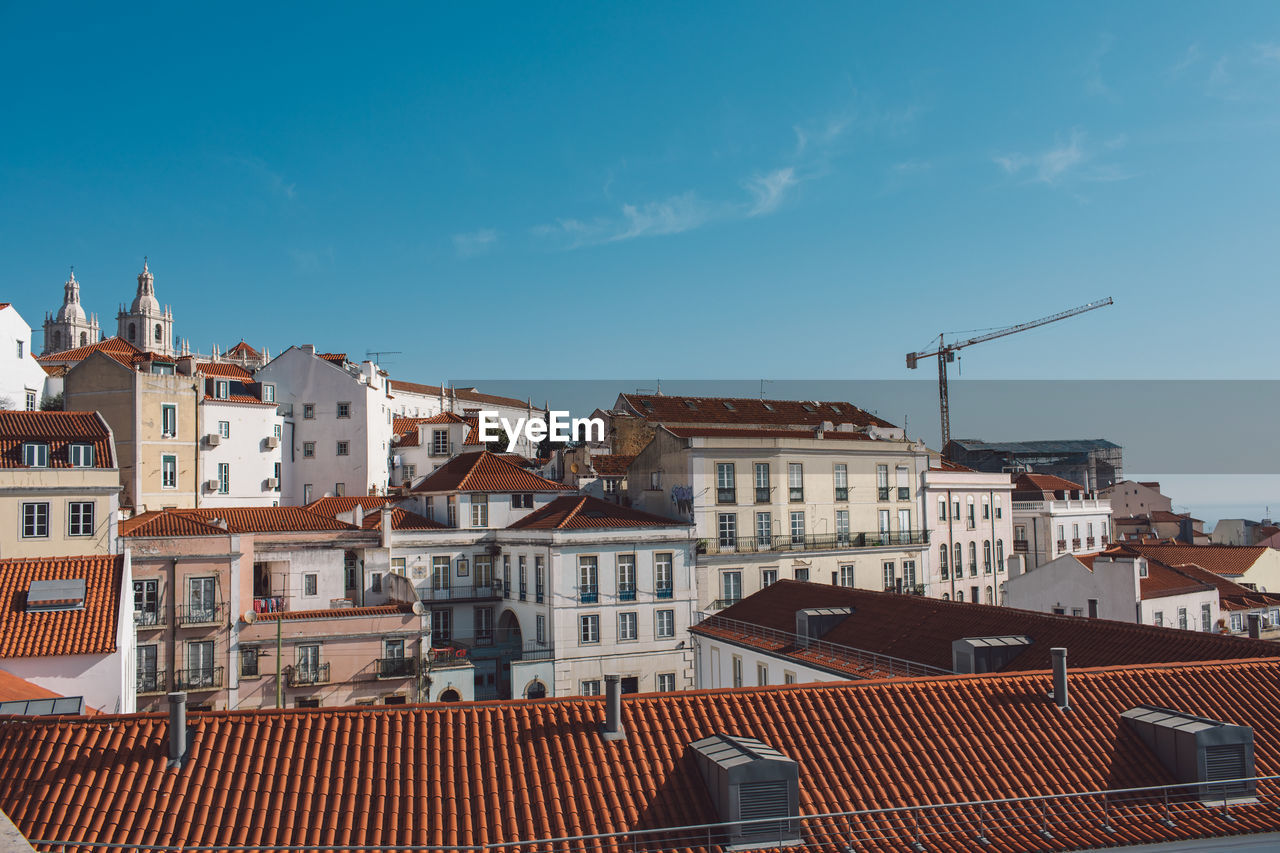 Buildings in city against sky