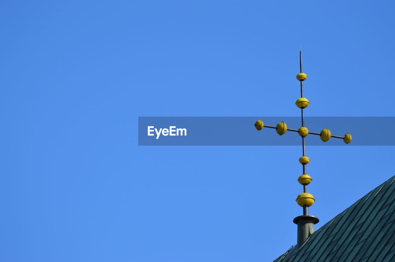 Low angle view of illuminated building against clear blue sky