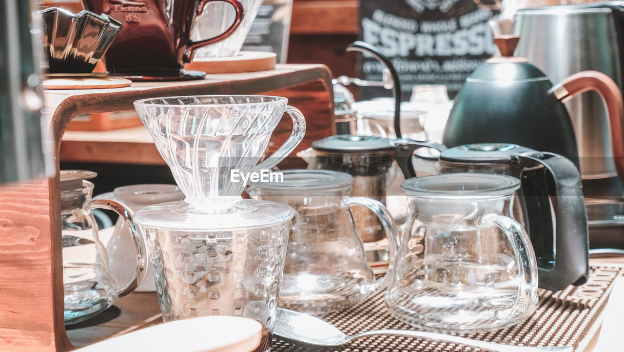 Close-up of coffee maker on table at cafe