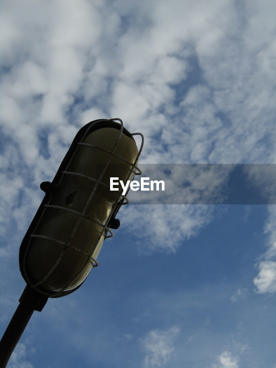 LOW ANGLE VIEW OF ELECTRIC LAMP AGAINST SKY