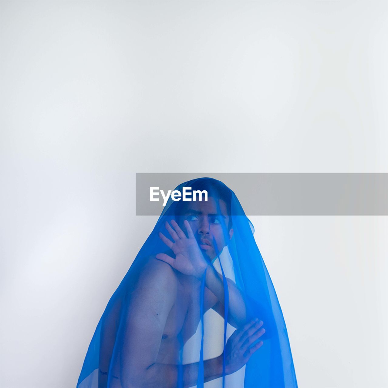 Low section of man with veil  against white background