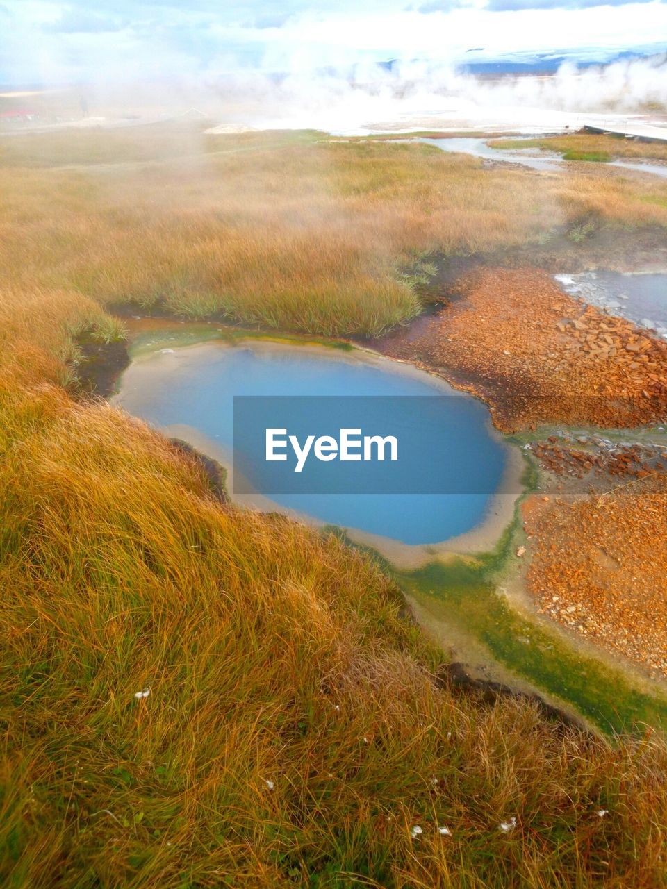 SCENIC VIEW OF LAKE AND LANDSCAPE AGAINST SKY