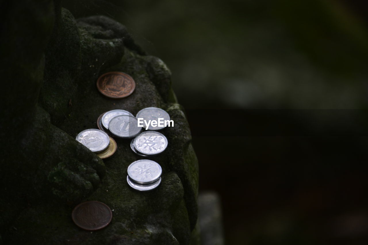 Coins on rock