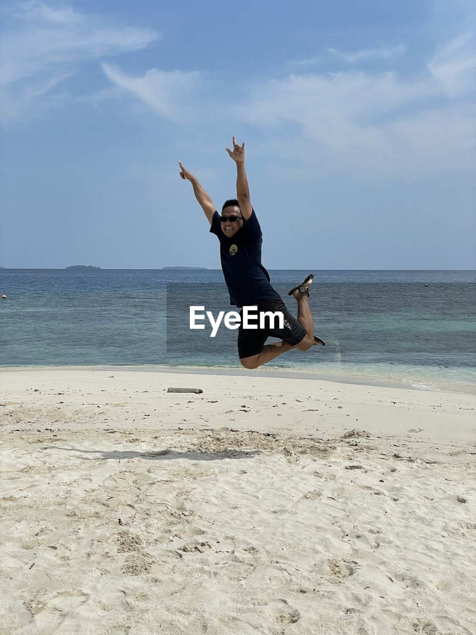 blue, full length, one person, sports, day, nature, adventure, leisure activity, extreme sports, mid-air, motion, sky, men, adult, risk, lifestyles, skill, outdoors, vitality, jumping, young adult, person, courage, cloud, casual clothing, warning sign, sign, joy, communication, sunlight, limb, challenge