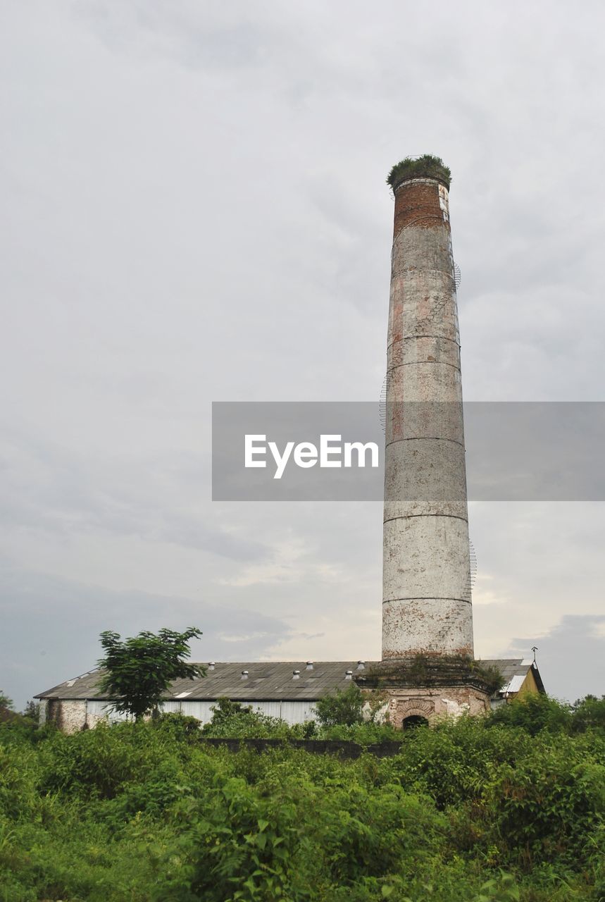 LOW ANGLE VIEW OF SMOKE STACK AGAINST SKY