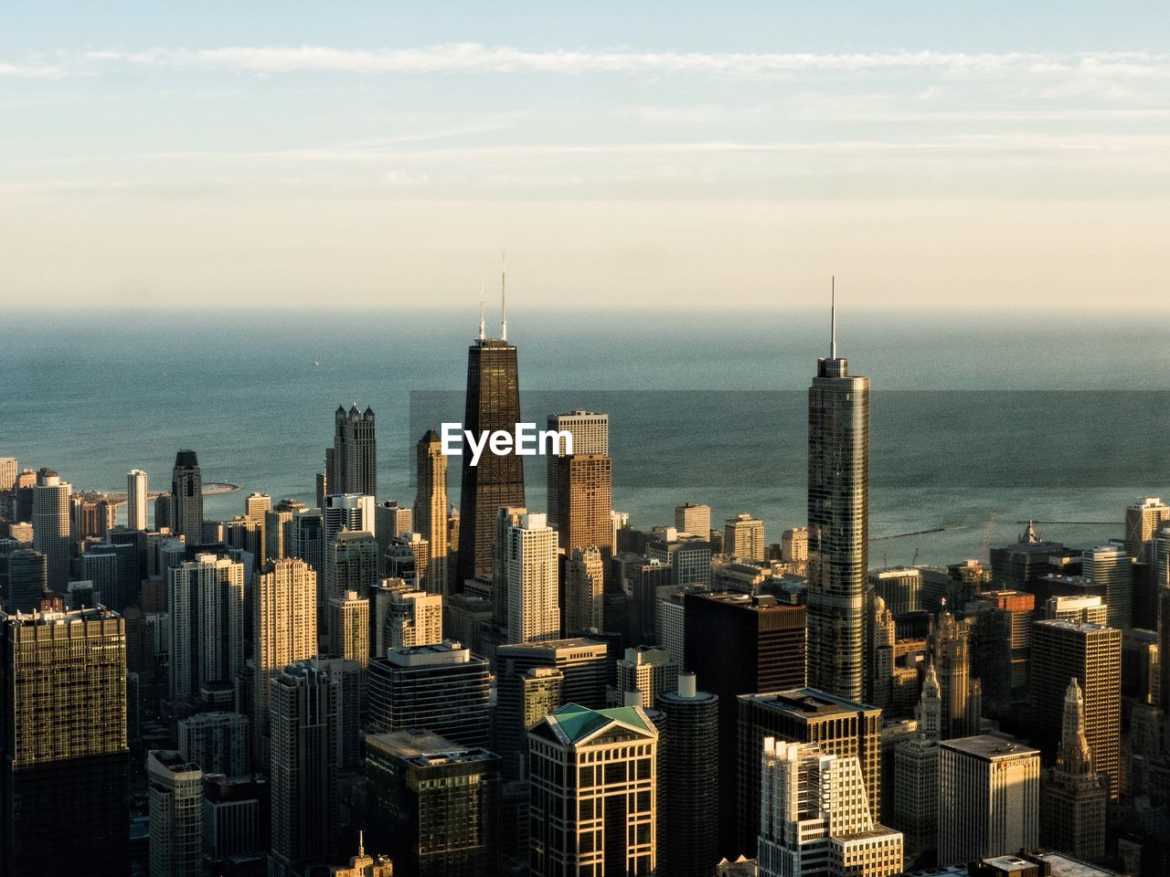 Aerial view of modern buildings in city against sky