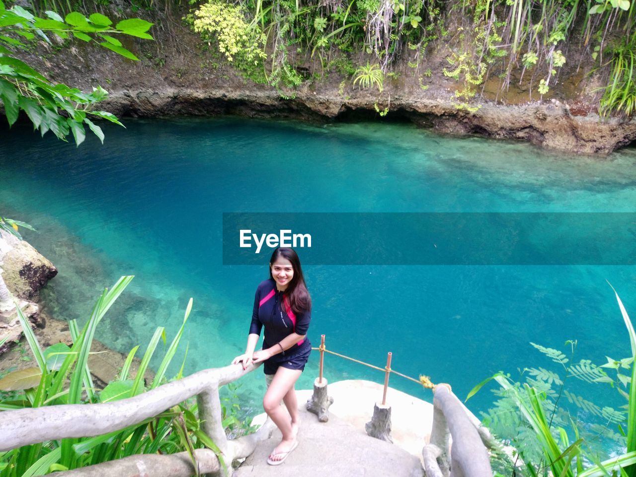 High angle portrait of young woman in water