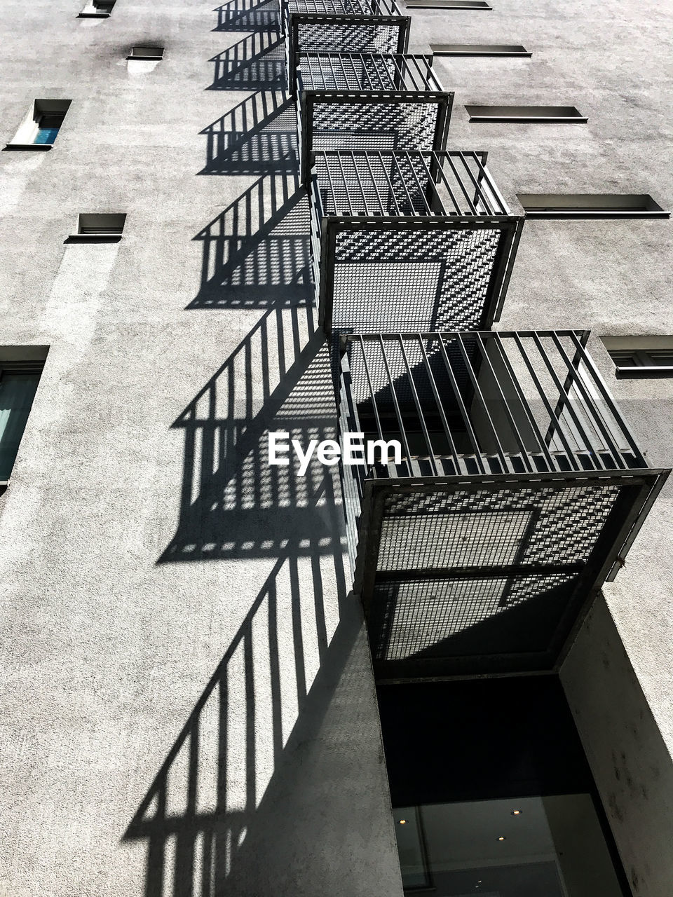 Low angle view of balconies throwing shadow