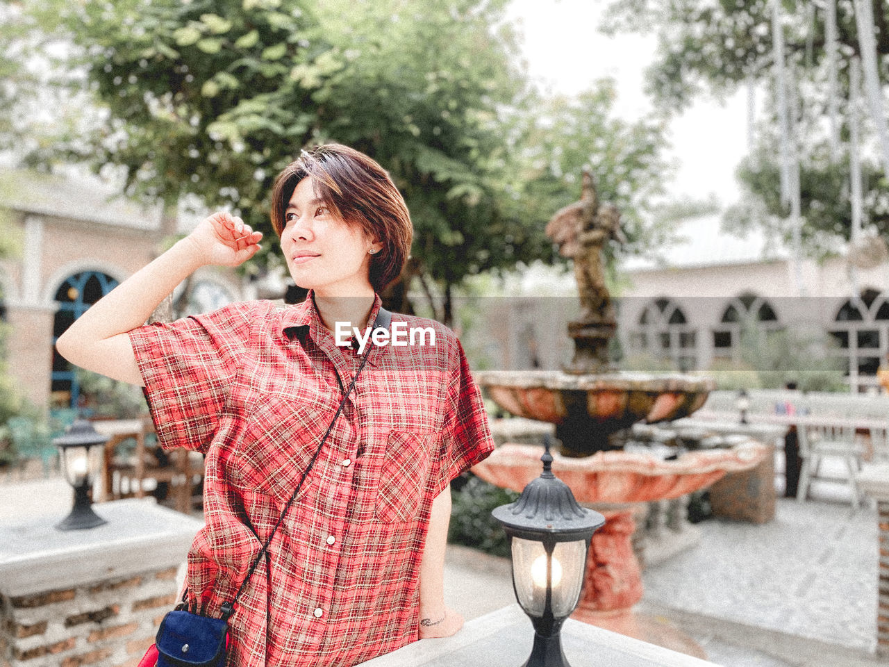 Man looking away while standing outdoors