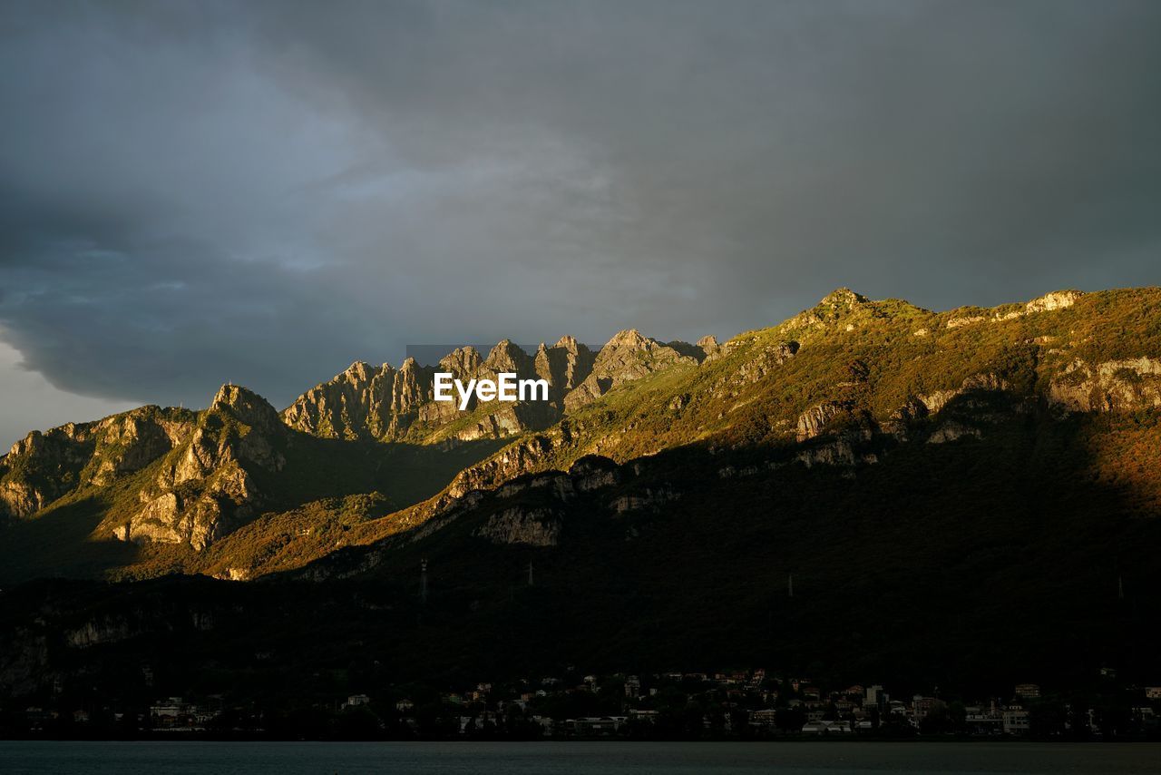 Scenic view of mountains against cloudy sky