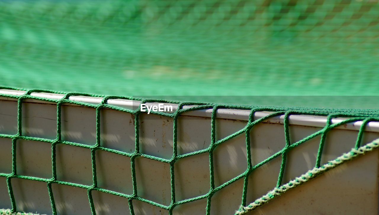 Close-up of net on wall