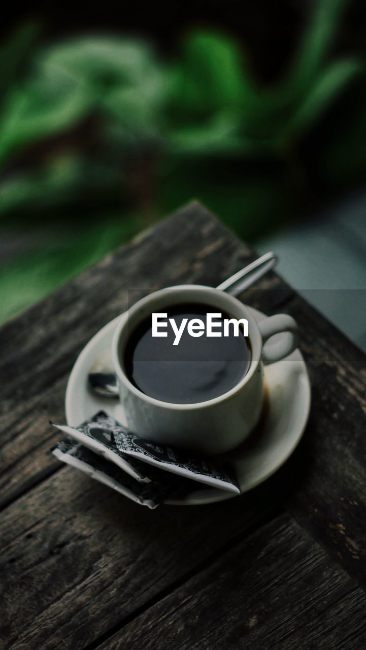 High angle view of coffee cup on table