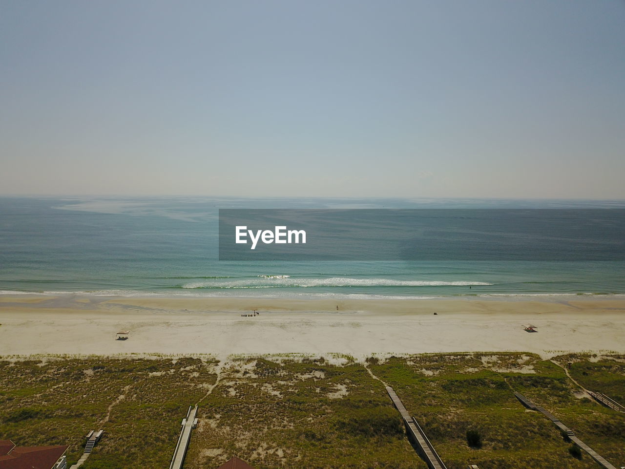 SCENIC VIEW OF BEACH AGAINST CLEAR BLUE SKY