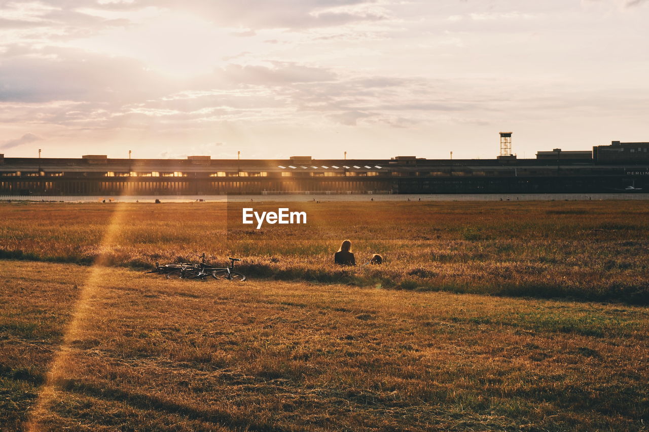 VIEW OF LANDSCAPE AGAINST SUNSET SKY