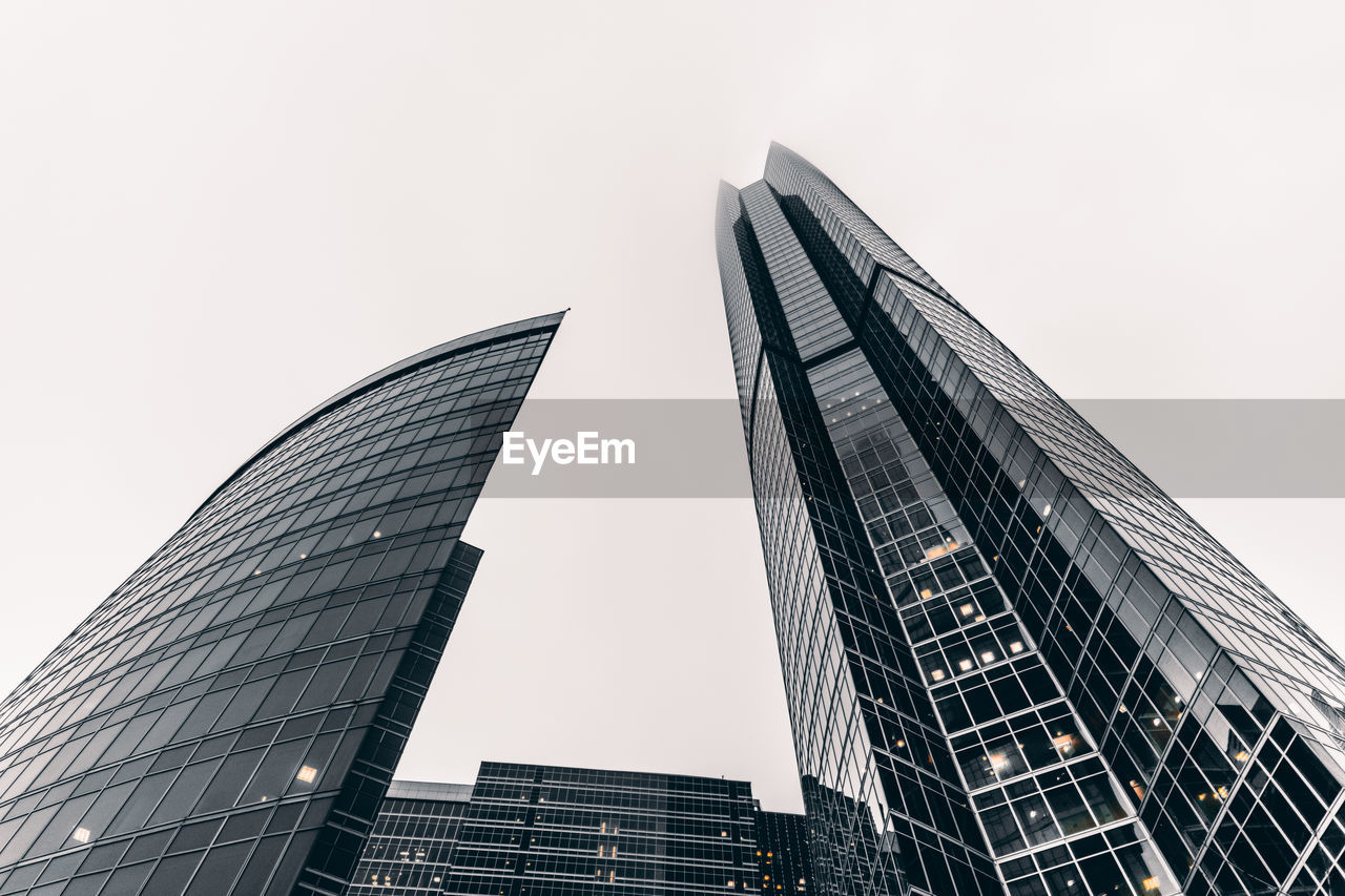 Low angle view of modern buildings against clear sky