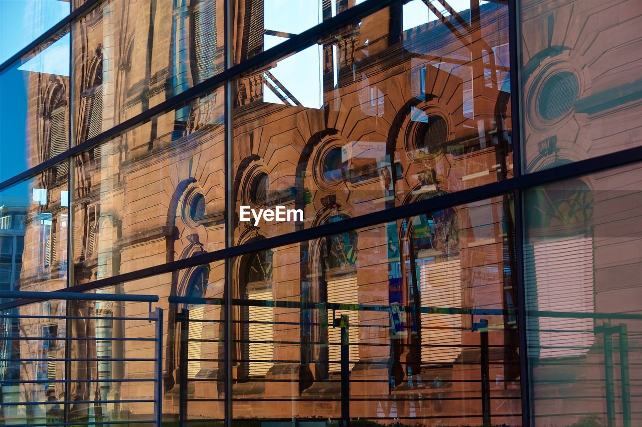 LOW ANGLE VIEW OF BUILDING WITH WINDOWS