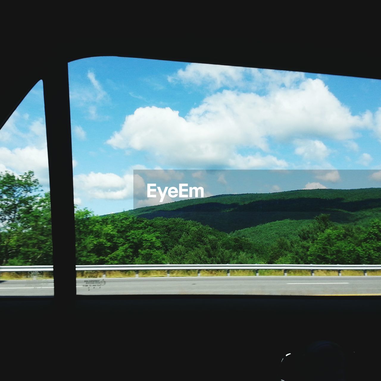 SCENIC VIEW OF MOUNTAINS AGAINST CLOUDY SKY