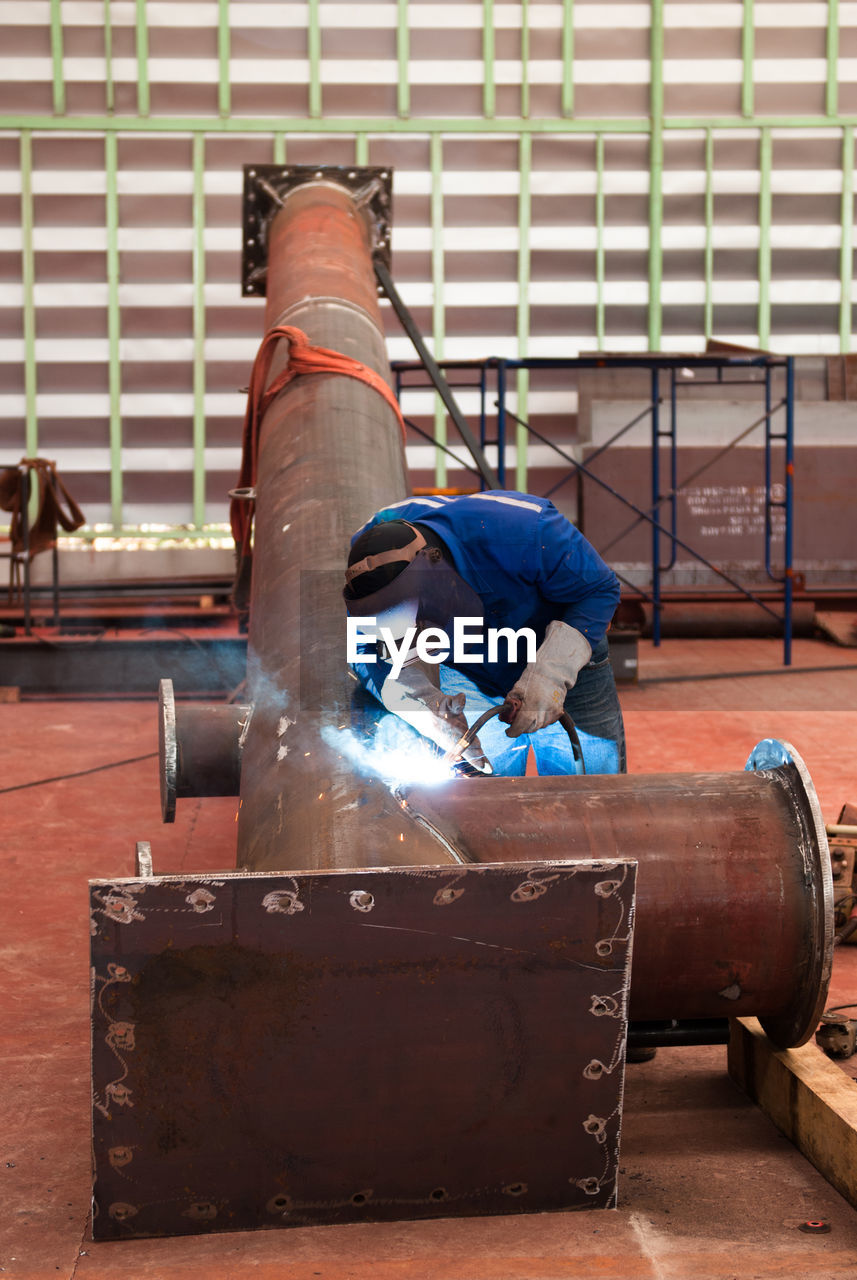 MAN WORKING WITH CONSTRUCTION SITE