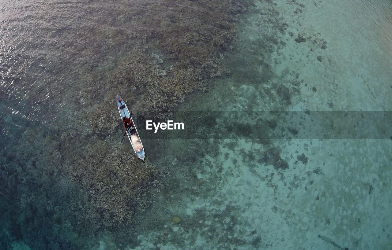 High angle view of man in boat on sea