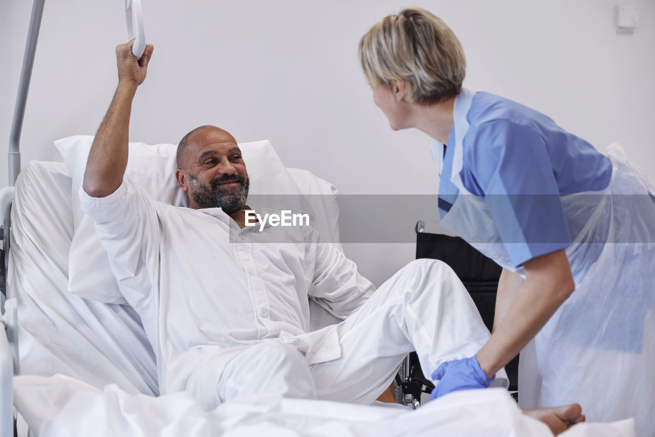 Nurse taking care of patient in hospital