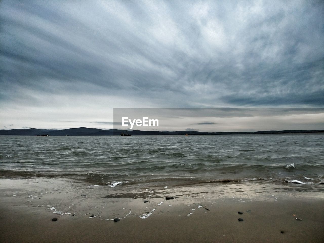 VIEW OF BEACH AGAINST SKY