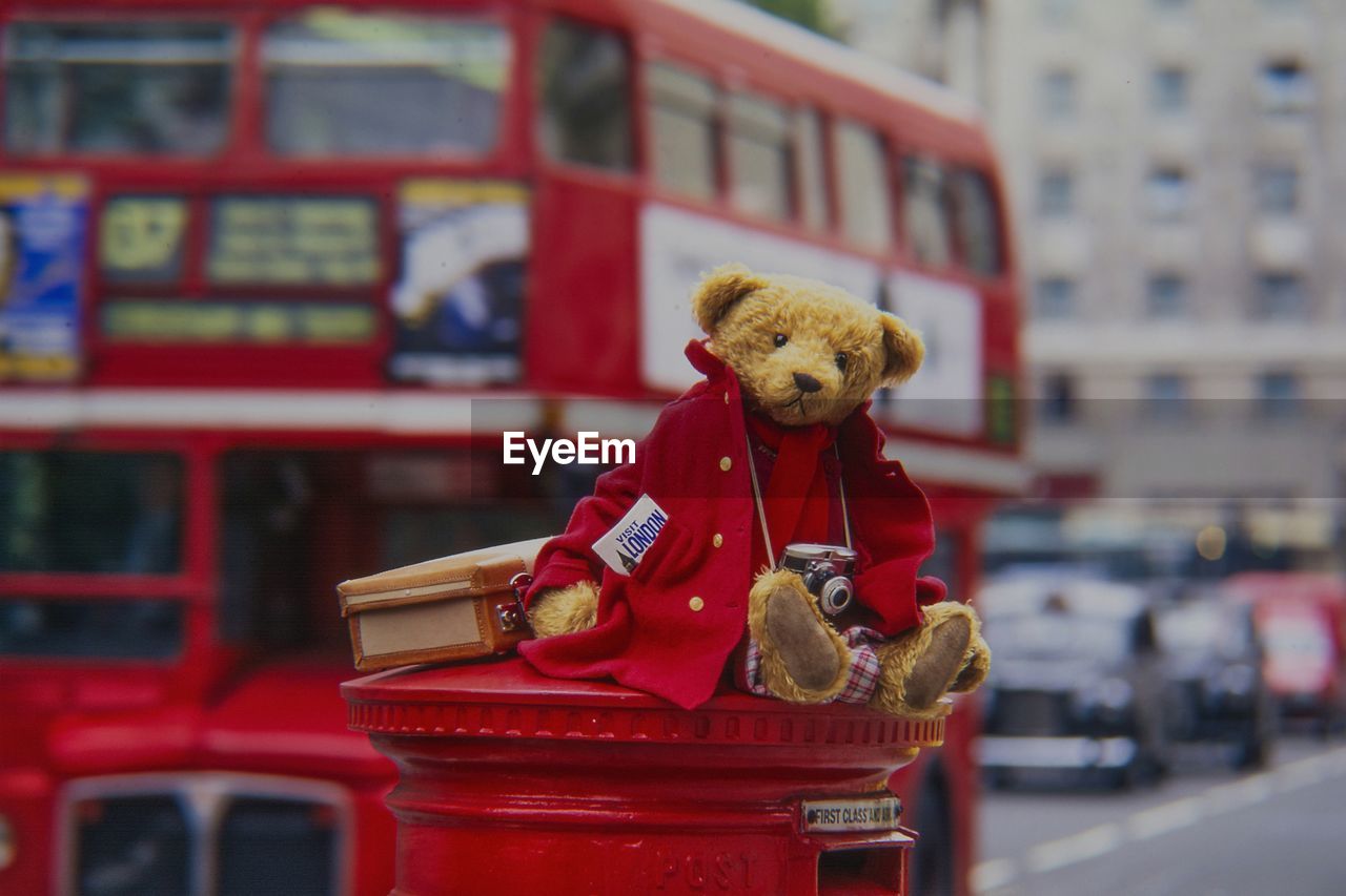 CLOSE-UP OF STUFFED TOY ON METAL