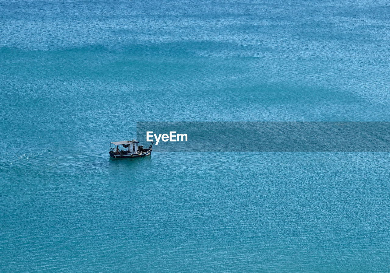 Beauty In Nature Blue Day Deep Blue Sea Fishing Boat Loneliness Mediterranean Sea Nature Nautical Vessel No People Outdoors Peaceful Sea Sky Spain, Andalucia, Malaga Torremolinos Tranquility Turquoise Water Live For The Story