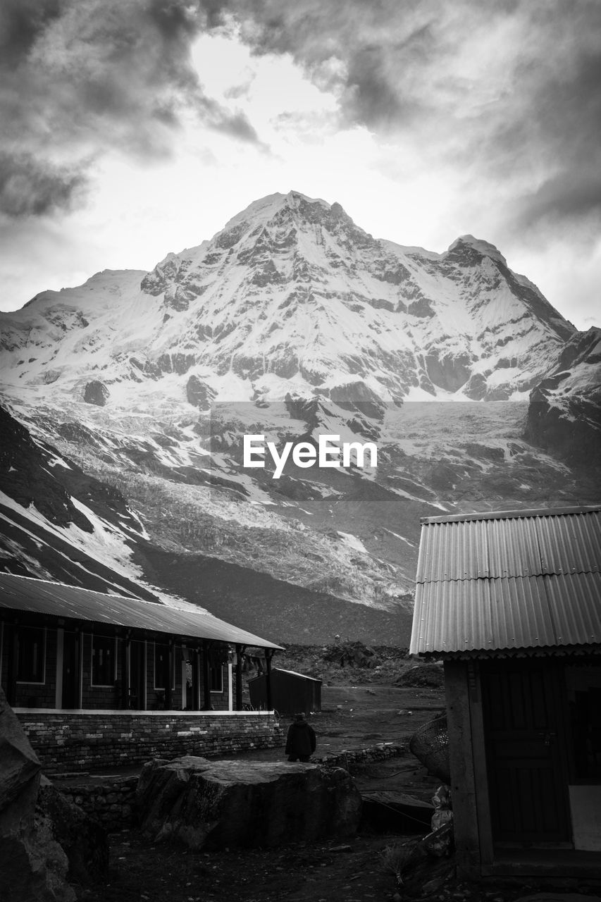 SCENIC VIEW OF MOUNTAINS AGAINST CLOUDY SKY