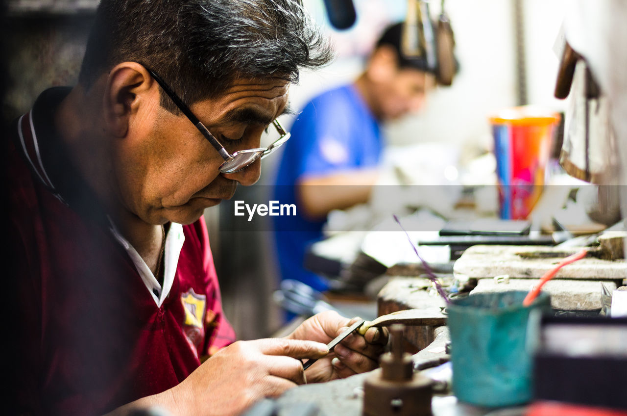 Man working on metal