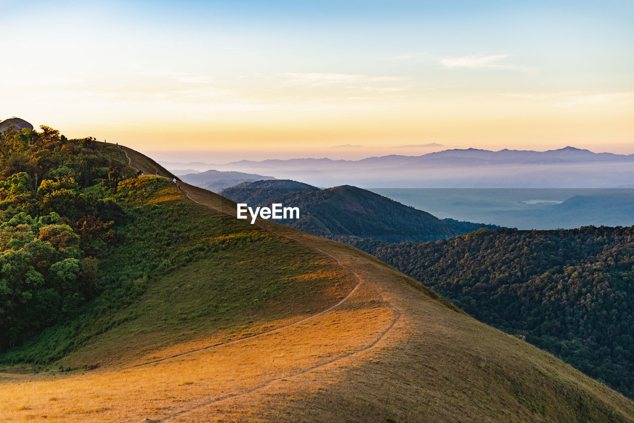 Scenic view of mountains against sky during sunset