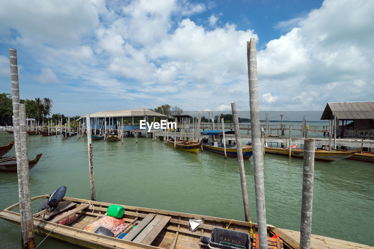 Boats moored at harbor