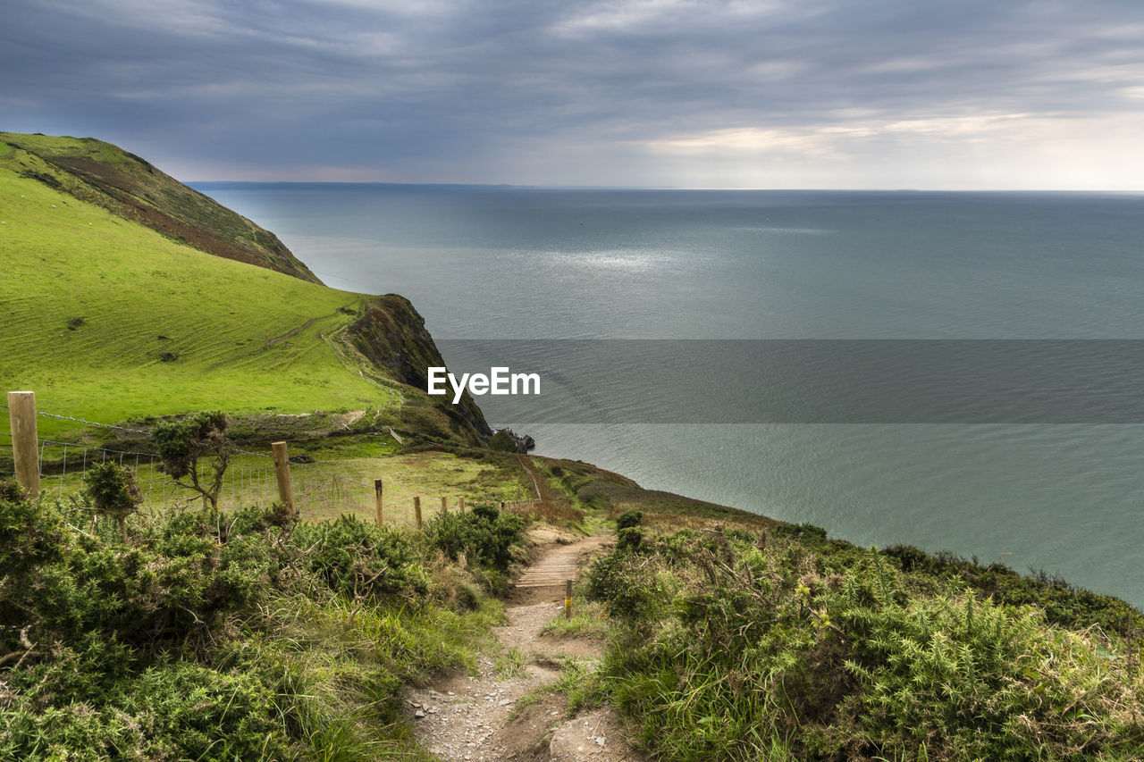 Scenic view of sea against cloudy sky