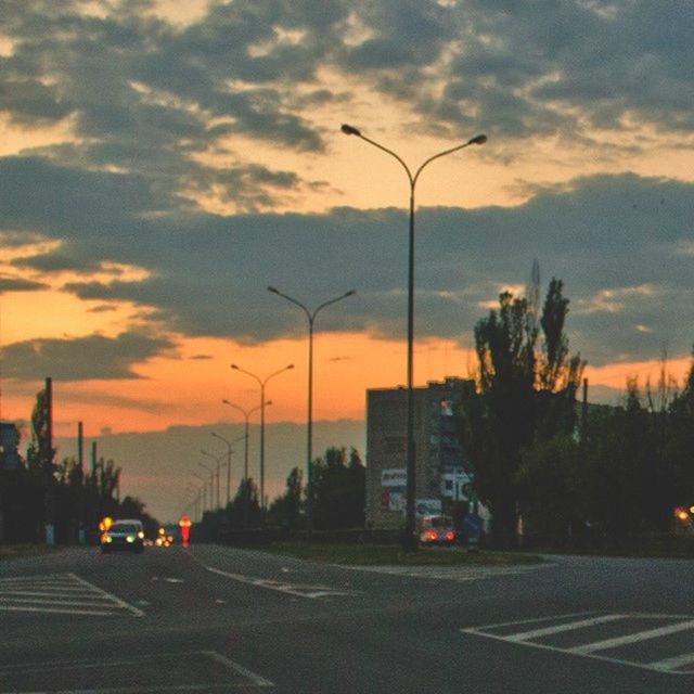 VIEW OF ROAD AGAINST CLOUDY SKY AT SUNSET