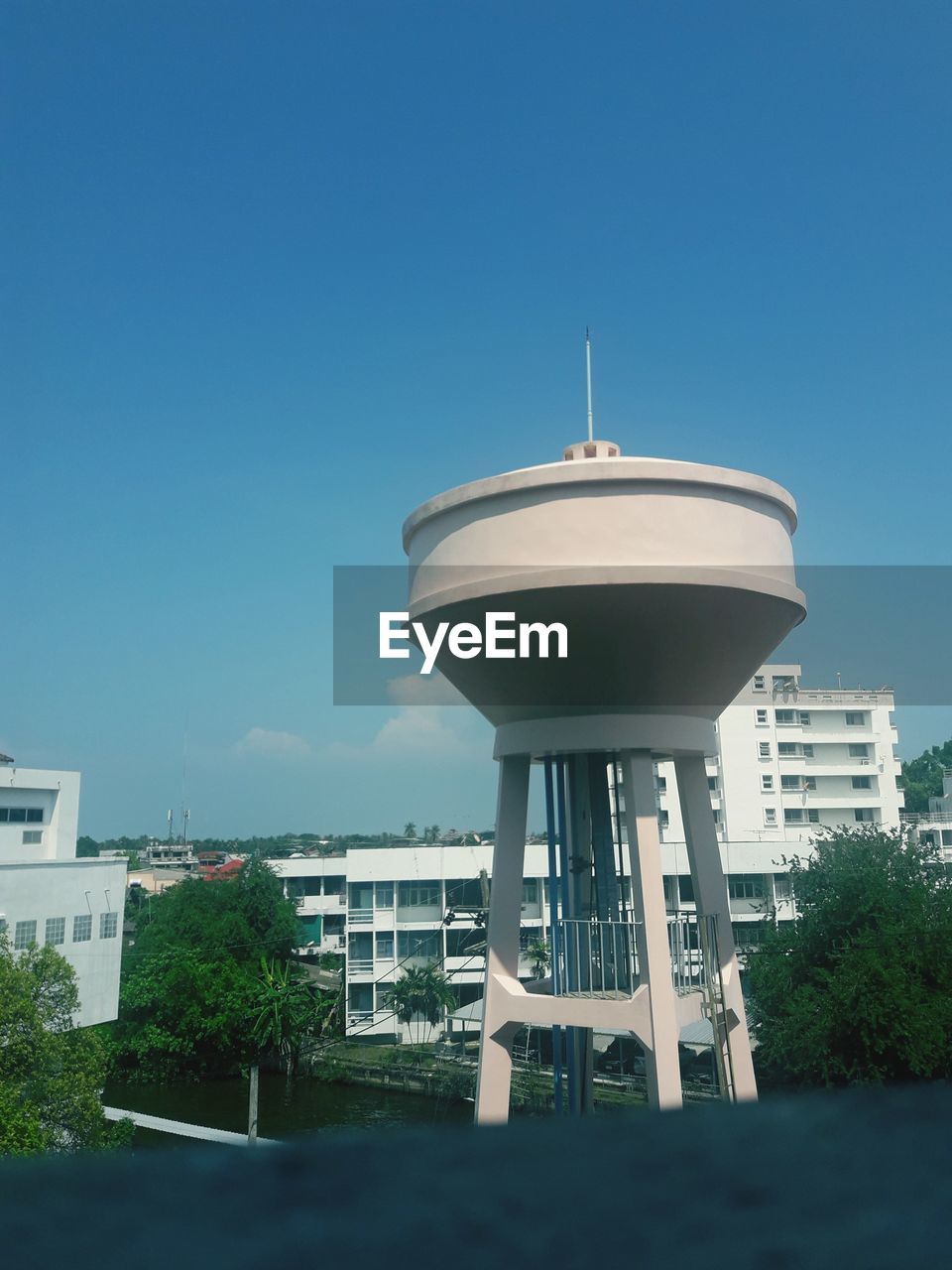 Low angle view of water tower against clear sky