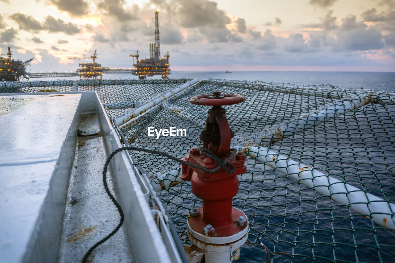 Fire monitor on a helideck of a construction work barge at offshore oil field