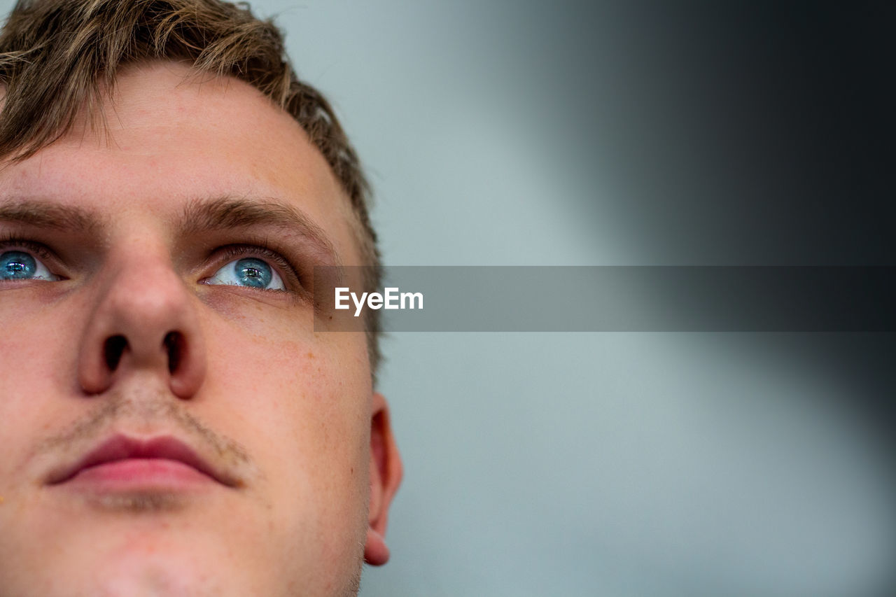 Close-up of young man looking up