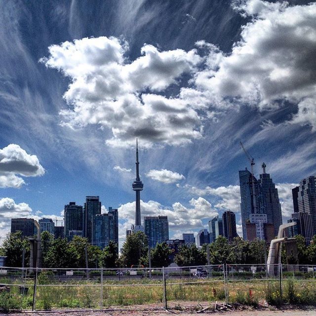 VIEW OF CITY AGAINST CLOUDY SKY