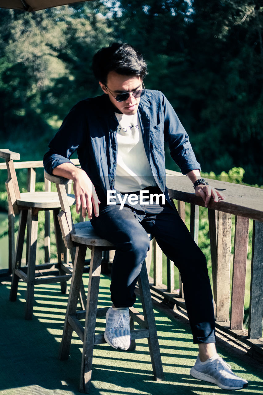 Man sitting on stool