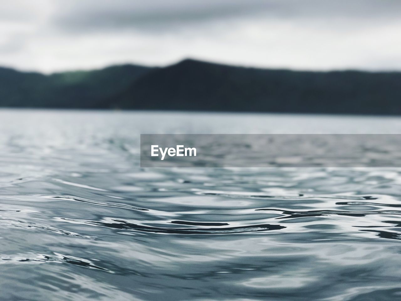 Close-up of rippled water against sky