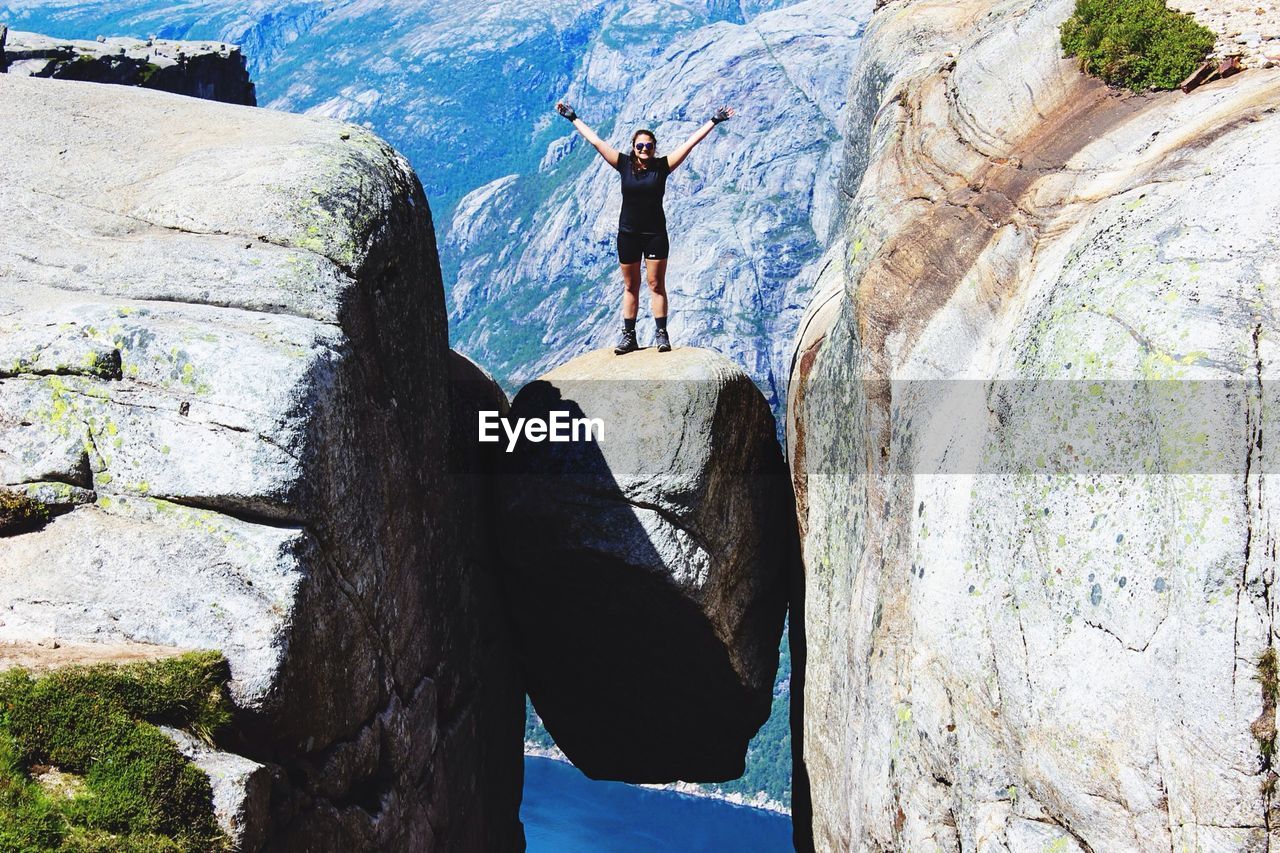 Woman standing on rock formation