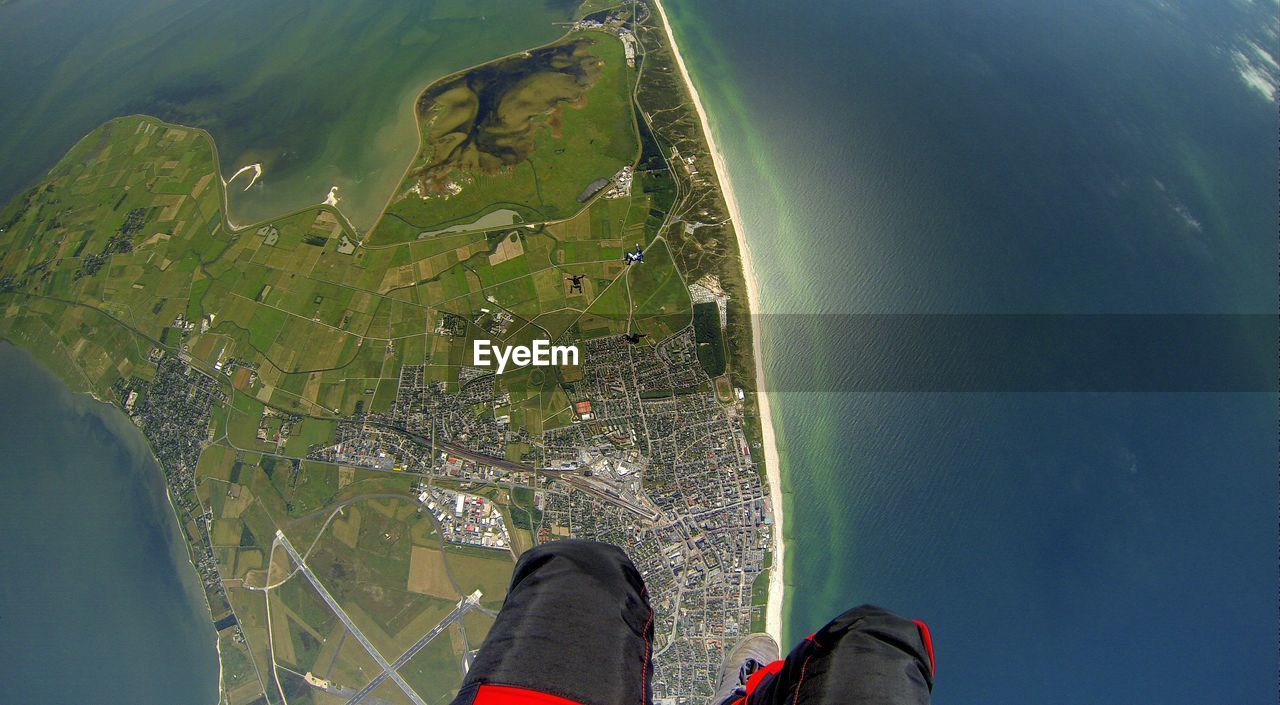Low section of person skydiving